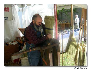 Jack Martin keeps the tradition of broom making alive, as he demonstrates the process for passersby.