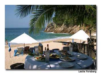 The resort serves up fresh, locally caught seafood at palm-shaded tables on the beach.