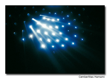 Tiny dots of light pierce through the dark of the “hot room.”