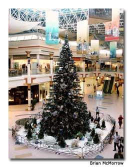 A decorated Christmas tree and fake snow add to the holiday cheer at the mall.