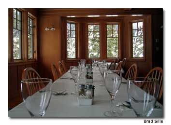 Tranquil winterscapes grace windows in the lodge dining room.