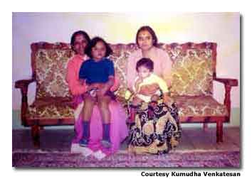 A childhood photo of Kumudha with family and friends represents a simpler time in Iraq.