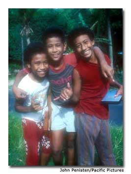 A trio of Pago Pago boys mug for the camera.