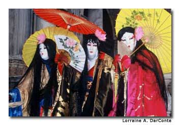 Three tall men dressed as China dolls scampered about the square on 6-inch sandals.