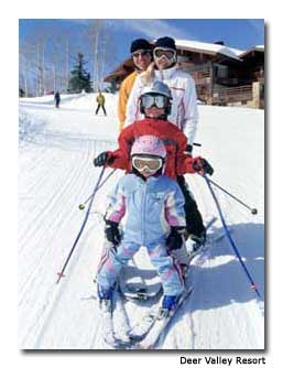 A family skies together at Deer Valley Resort in Park City, Utah.