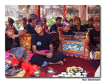 Balinese men work on decorations for the tower. 