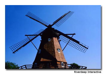 Visitors enjoy windmills, canals and rides in the amusement park. 
