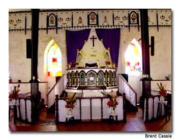 Sun filters through stained panes of the island’s oldest church, Cook Islands Christian Church.