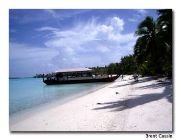 A Kon-Tiki-like catamaran takes the author on a tour of tropical motus (islets).