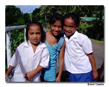 On Aitutaki Island, wide-eyed children smile when we pass.