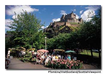Edinburgh Castle towers over the city&rsquo;s Old Town, with its outdoor cafes and tea shops.