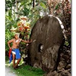 A Yap native stands aside the proud gem of his culture: ancient Stone Money, brought over from Palau.