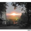 The sun sets behind Castle Schönburg, which overlooks the lush wine-growing region of Salle-Unstrut