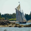 A Maine Windjammer cruises through a narrow passage in Maine.