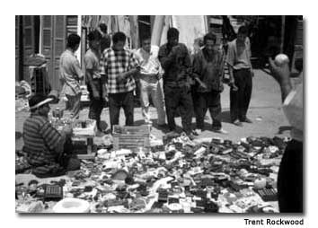 Tourists and local residents gather at the “Friday Market” to do some bargain shopping.