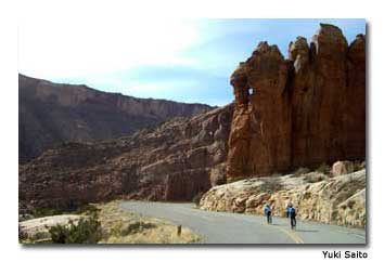 Cyclists sail down the hills at Arches, one of two national parks within cycling distance of Moab.