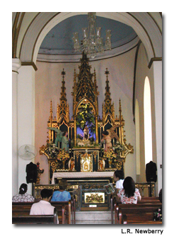 Visitors enjoy the serenity of the chapel in Catedral Nuestra Señora de la Guadalupe.