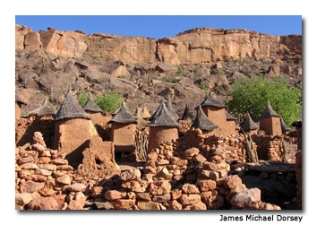 Dogon built their villages on slopes, creating elaborate mud houses with thatched roofs that, from a distance, blend perfectly with the land.