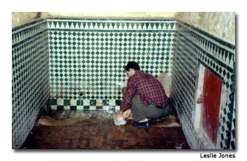 A local resident fetches water at one of Medina’s beautifully tiled watering holes.