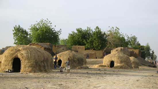 Grass fulani huts in Africa. Photo by James Dorsey