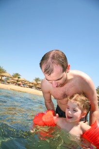 Father with a daughter on the sea