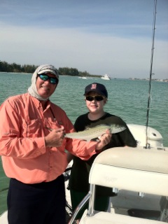 Captain Terry and Kyle Stukel with a Speckled Trout in Siesta Key, Florida