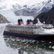 The Disney Wonder cruise ship sails past glaciers at the Tracy Arm Fjord in Alaska.