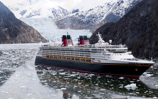 The Disney Wonder cruise ship sails past glaciers at the Tracy Arm Fjord in Alaska.