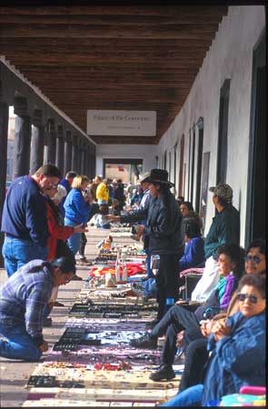 Along the border of the plaza next to the Palace of the Governors local Native Americans sell beautiful artwork, jewelry and pottery.