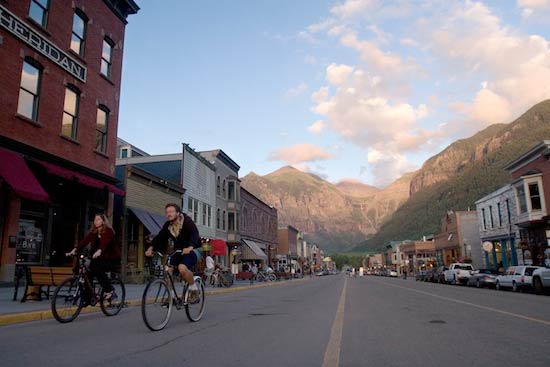Biking down Telluride's main drag. Photo by Matt Inden/Colorado Tourism Office