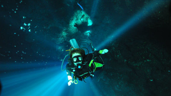 Diving in the Cenotes of the Yucatan - Natural light spill into The Pit. 