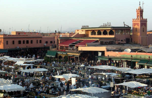 The square is filled with vendors of all kinds. 