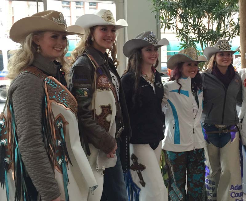 Rodeo queens from the National Western Stock Show pose for photos. Photo by Janna Graber