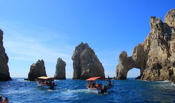 Boating past the famous arch in Los Cabos. Photo by Janna Graber