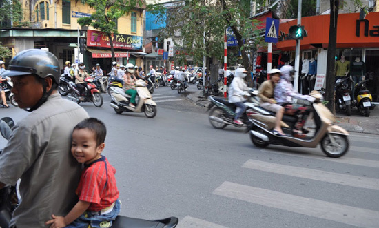 Rush hour in Hanoi is a confusing maze of traffic. Photo by Olivier Guiberteau 