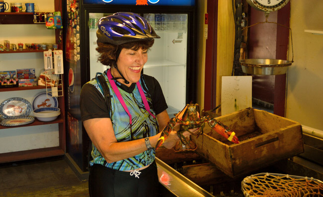 The author holding a live lobster in Maine. 