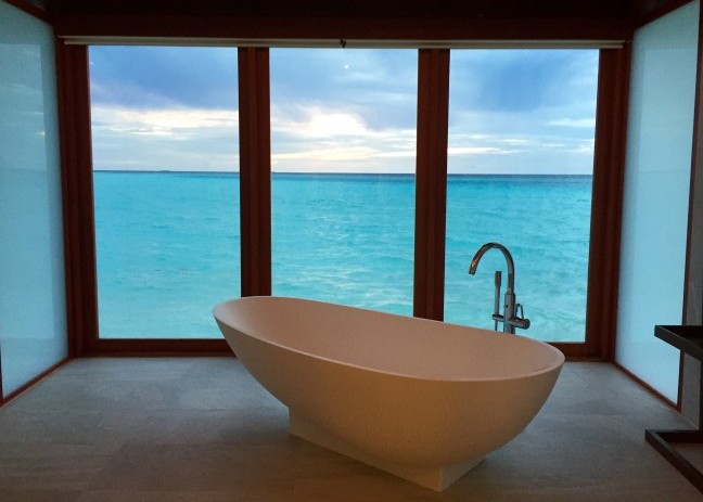 The bathroom in this villa at Anantara Dhigu in the Maldives features floor to ceiling windows. Photo by Janna Graber