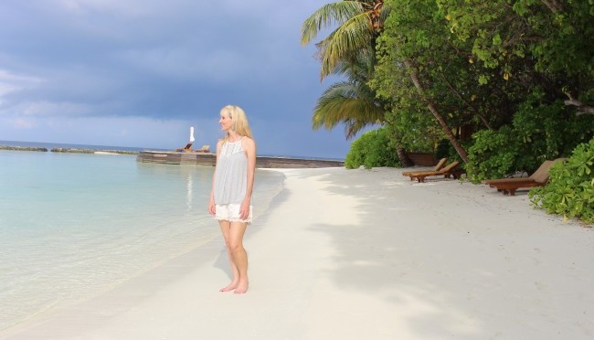 Travel journalist Janna Graber on the beach behind her villa at Baros Maldives.