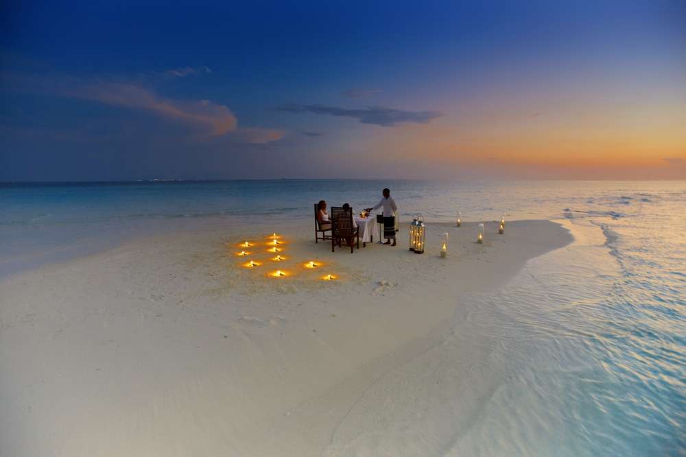 Baros offers a a private dinner for two prepared and served by your own private chef on a small sandbank in the middle of the crystal blue sea at sunset. Photo courtesy Baros.