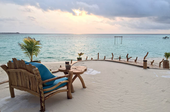 Watching the sun set at AaaVeee in the Maldives. Photo by Janna Graber