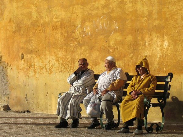 Moroccan men sitting. Photo by Flickr/Carlos ZGZ