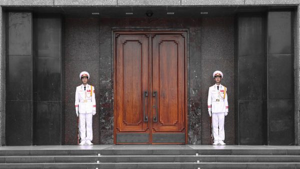 Two sentries guard the entrance to the Ho Chi Minh Mausoleum, Ba Dinh Square, Hanoi, Vietnam. Photo by Flickr/joolsgriff