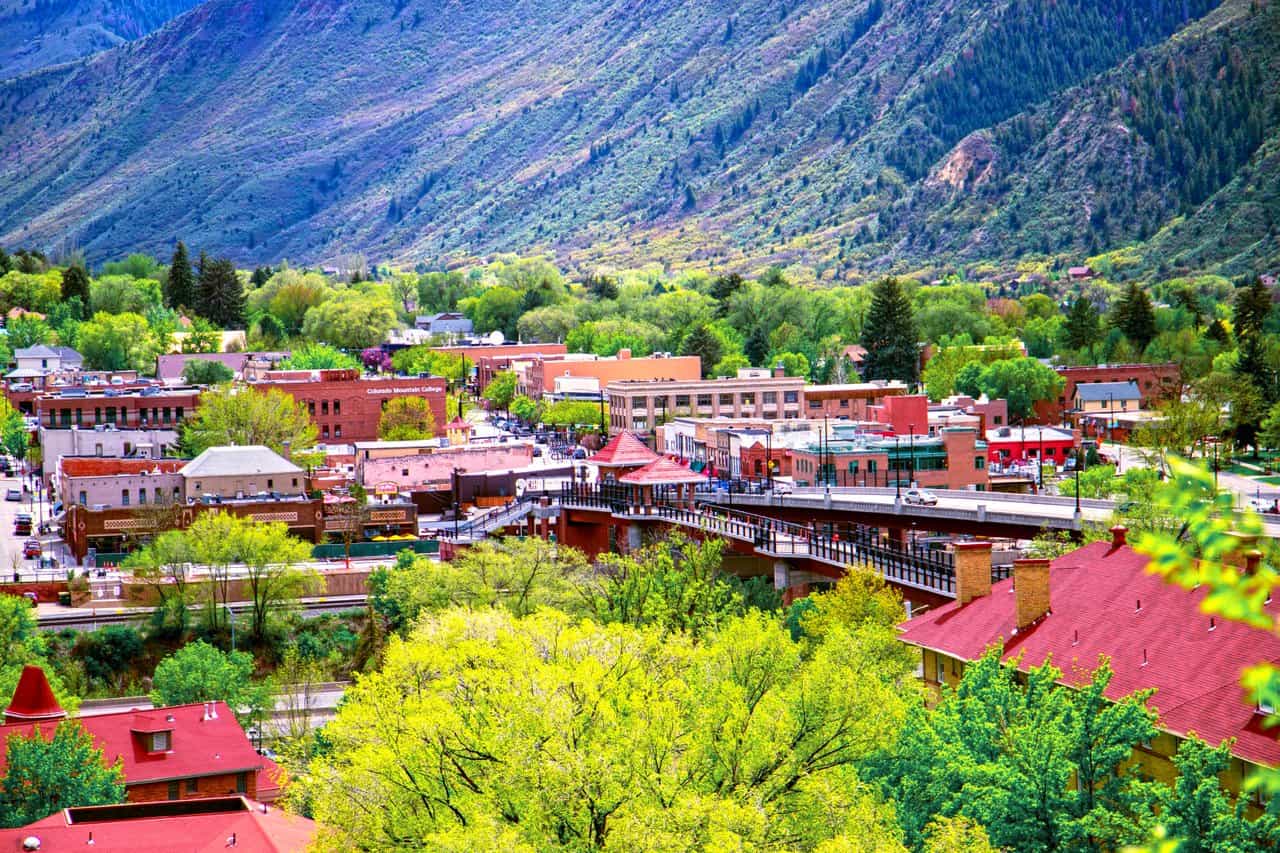 The tree-lined streets of Glenwood Springs lead to natural hot springs that have drawn visitors since the 1880s. Photo courtesy of Visit Glenwood Springs