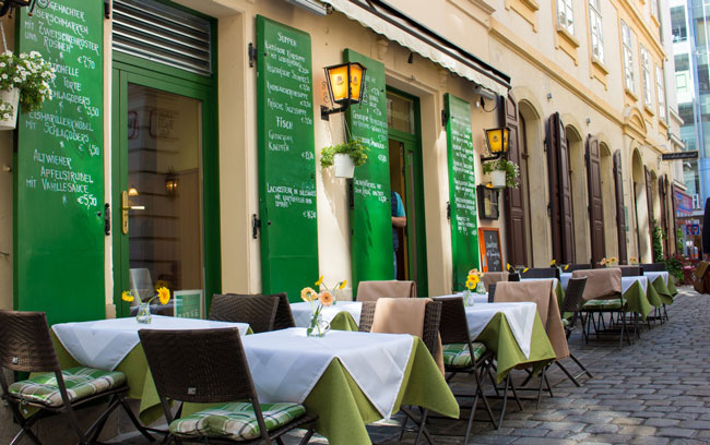 Outdoor patios line the streets in Vienna. Photo by Janna Graber