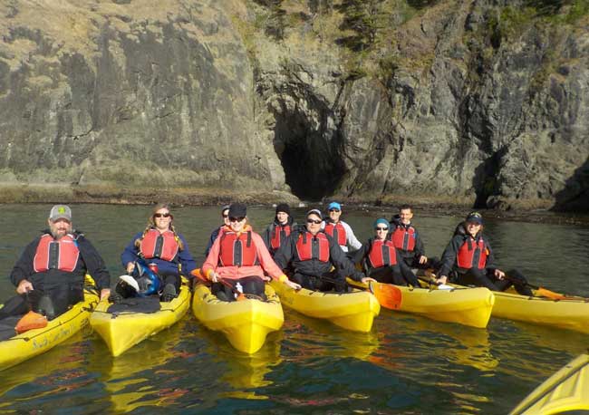 Sea kayaking with South Coast Tours LLC in Port Orford, OR. Photo by South Coast Tours