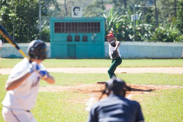 Baseball in Cuba - Cuban players and a team of former Amherst College baseball players during a game. Photo by Rob Born.