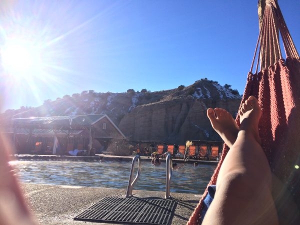 Laying in a hammock poolside at Ojo Caliente 