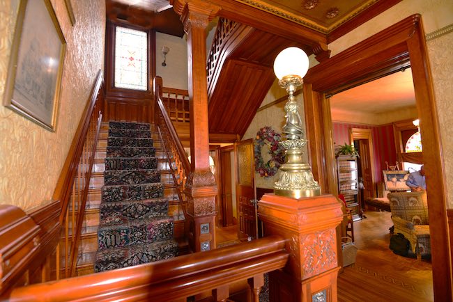 Staircase showing rich woodcarvings, photo courtesy of Nagle Warren Mansion