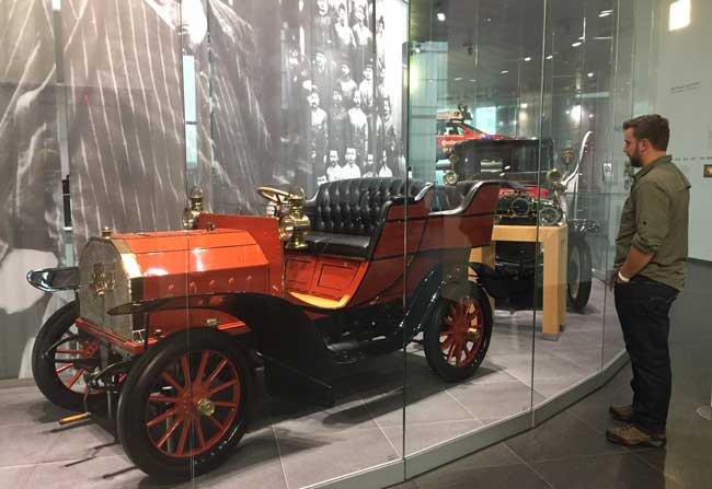 Ben inspects a 1903 Horch. Horch was one of four companies that went together to form Audi. Photo by Janna Graber