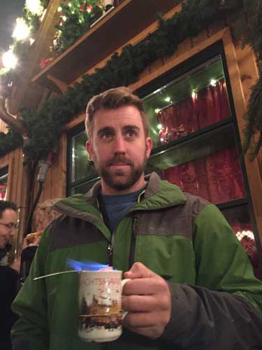 Ben tries feuerzanbowle, a hot drink made with mulled wine and rum which is lit on fire. Photo by Janna Graber